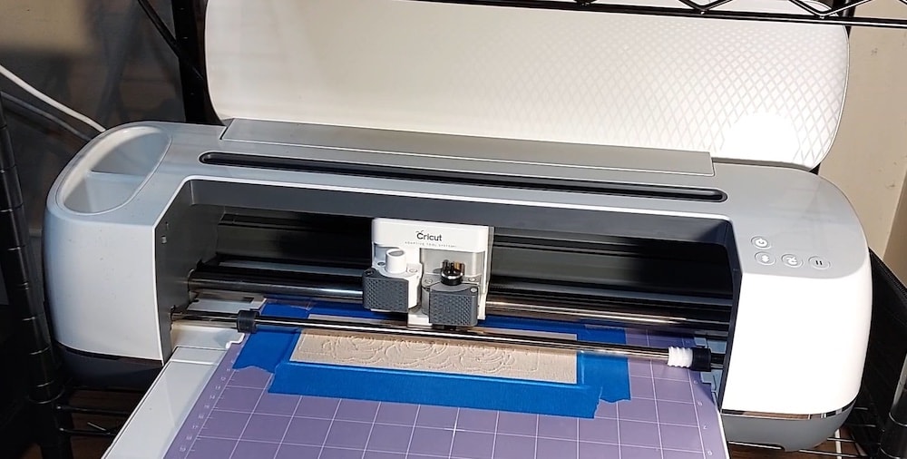 Step 4c: Press the Cricut button to run the cut Step 4c: The cut is in progress.